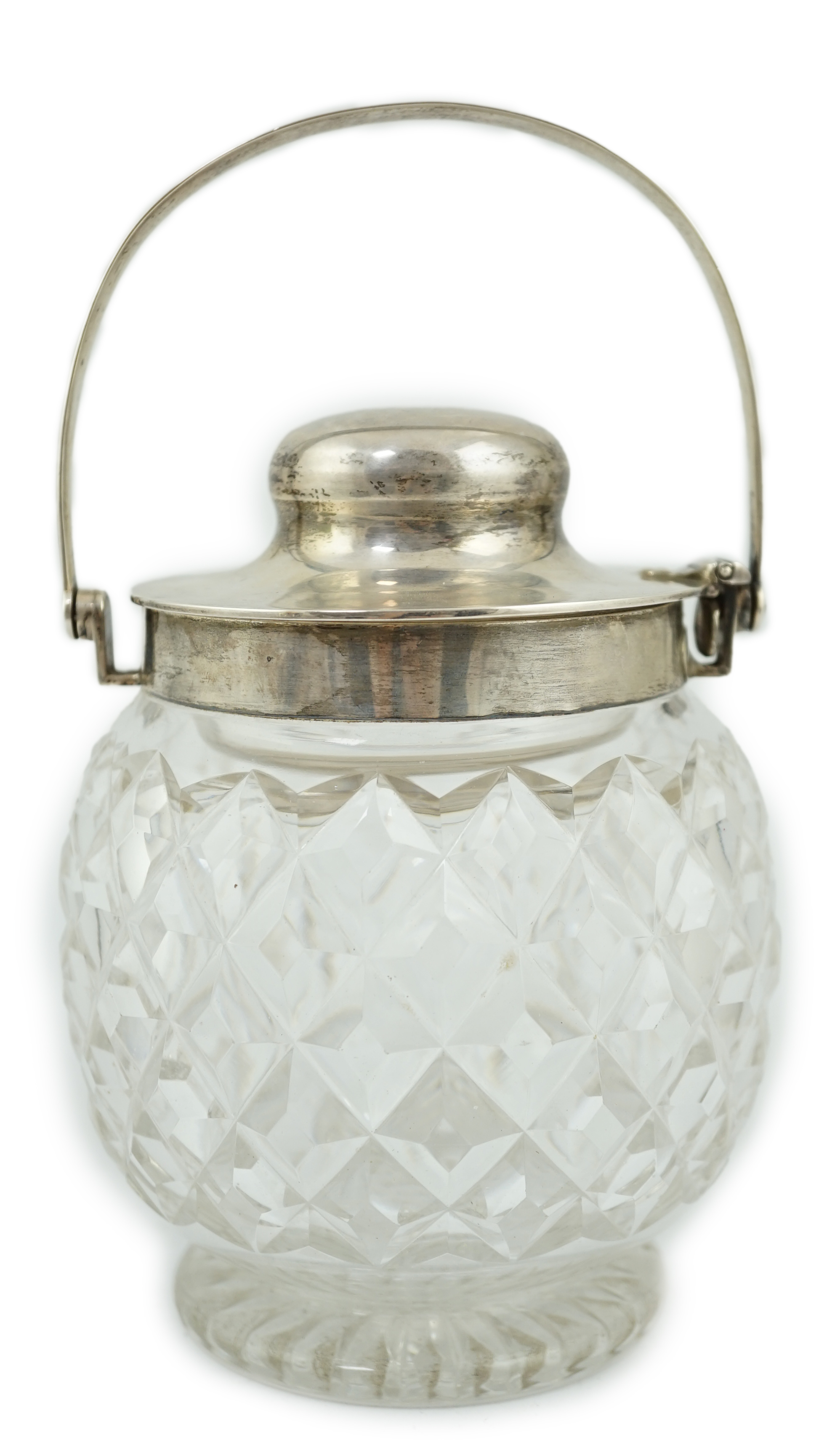 A George V silver mounted cut glass patent action biscuit barrel, by Hukin & Heath